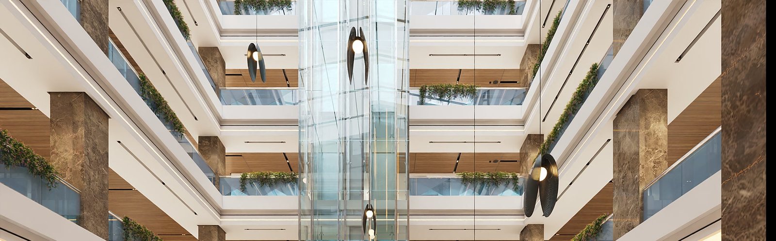 The atrium of CBC Tower: balconies with hanging plants on every floor around a glass lift column